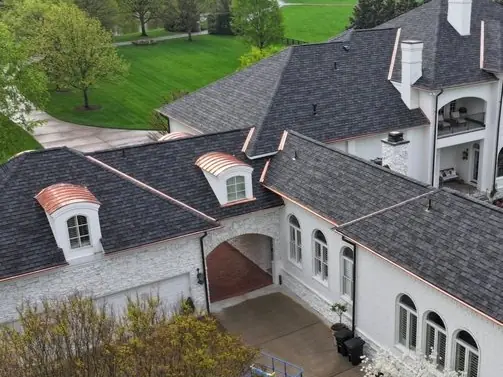 Stucco and stone home with a new architectural shingle roof and tile accents, Middle Tennessee