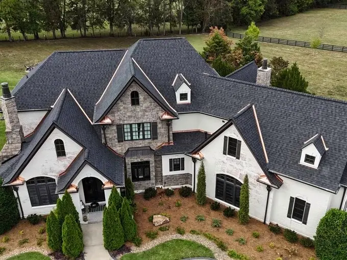 Stone-front estate with a new charcoal architectural shingle roof, Williamson County TN