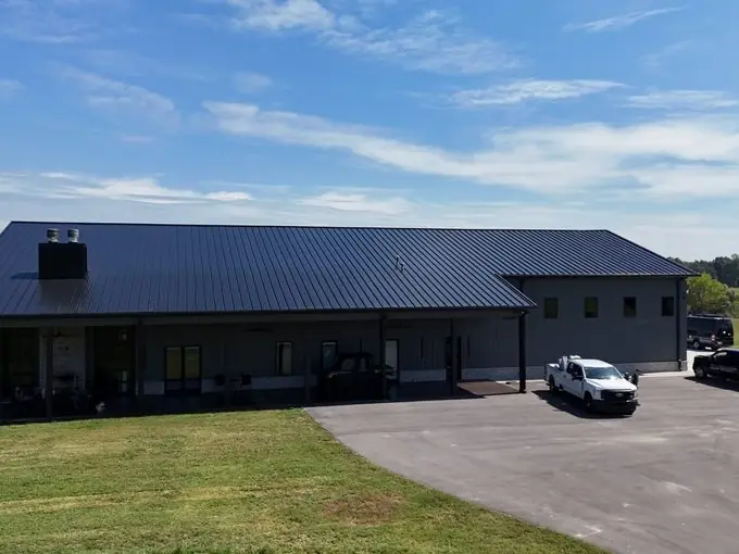 Commercial metal building with a new standing seam metal roof installed by Three Stone