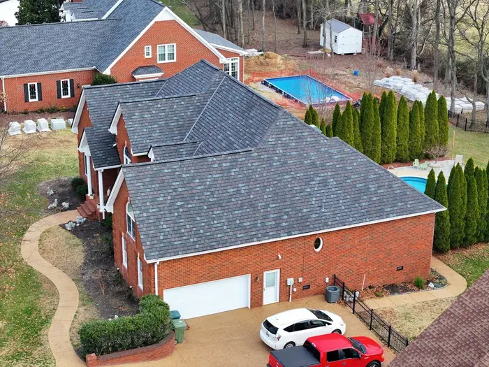 Red brick home with a new charcoal shingle roof and pool, Murfreesboro TN