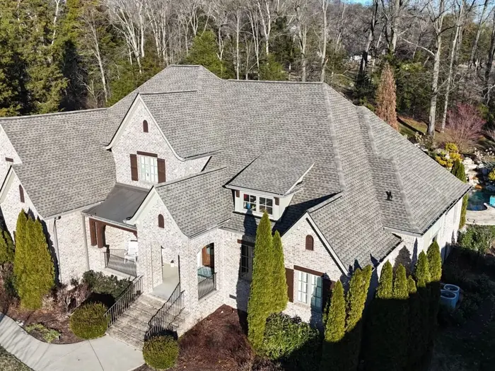 French country stone home with a new architectural shingle roof, Brentwood TN
