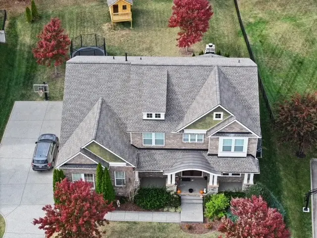 Craftsman home with a new architectural shingle roof and covered entry