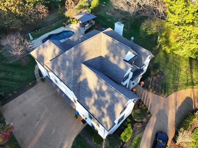 Weathered-wood shingle roof replacement seen from above