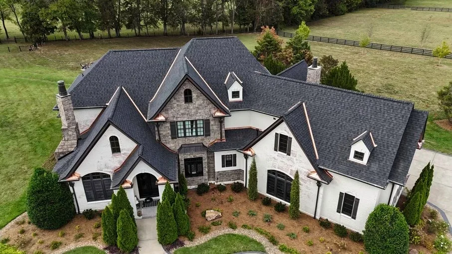 Completed roof replacement on a stone estate in Williamson County, TN