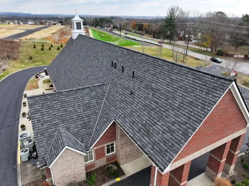 Three Stone roofing crew working on a residential roof in Middle Tennessee